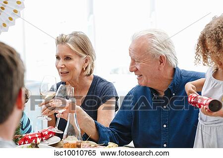 Family talking and bonding at home party View Large Photo Image Stock Photography - Family talking and bonding at home party. Fotosearch