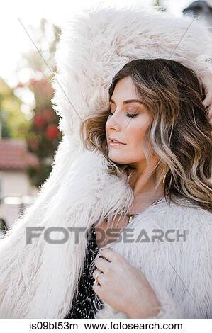 Fashionable woman in fake fur coat View Large Photo Image Picture - Fashionable woman in fake fur coat. Fotosearch
