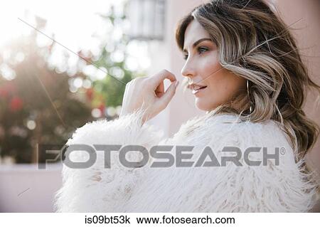 Fashionable woman in fake fur coat View Large Photo Image Stock Image - Fashionable woman in fake fur coat. Fotosearch