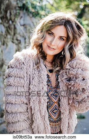 Fashionable woman in fringe coat View Large Photo Image Stock Image - Fashionable woman in fringe coat. Fotosearch