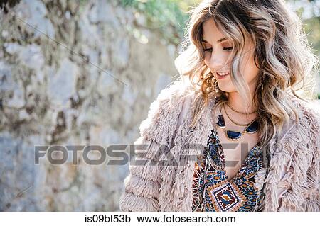 Fashionable woman in fringe coat View Large Photo Image Stock Image - Fashionable woman in fringe coat. Fotosearch