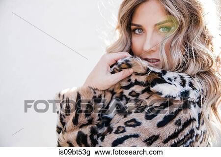 Fashionable woman in leopard print coat View Large Photo Image Stock Image - Fashionable woman in leopard print coat. Fotosearch