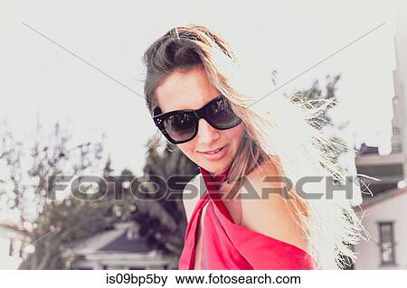Fashionable young woman in sun View Large Photo Image Stock Photo - Fashionable young woman in sun. Fotosearch