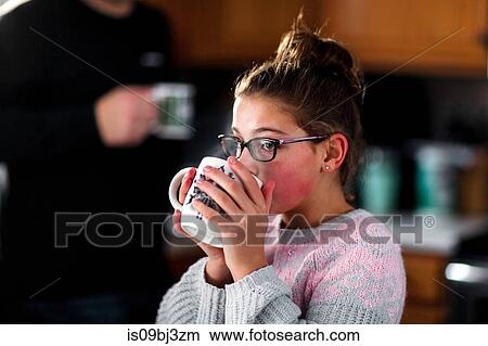 Father and daughter drinking in kitchen View Large Photo Image Picture - Father and daughter drinking in kitchen. Fotosearch