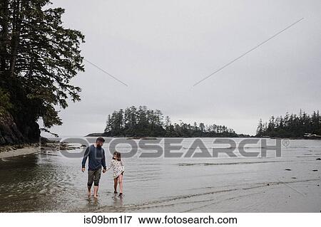 Father and daughter on beach, Tofino, Canada View Large Photo Image Stock Photo - Father and daughter on beach, Tofino, Canada. Fotosearch