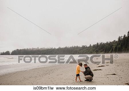 Father and daughter on beach, Tofino, Canada View Large Photo Image Stock Photo - Father and daughter on beach, Tofino, Canada. Fotosearch