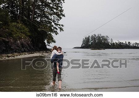 Father and daughter on beach, Tofino, Canada View Large Photo Image Stock Photograph - Father and daughter on beach, Tofino, Canada. Fotosearch