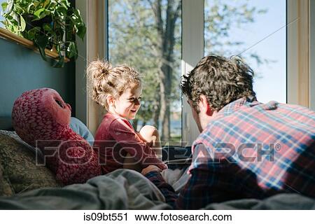 Father and daughter talking in bed View Large Photo Image Stock Image - Father and daughter talking in bed. Fotosearch