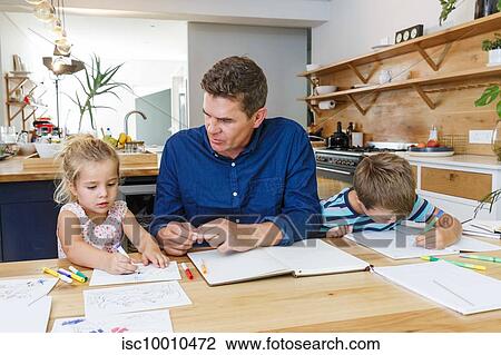 Father helping children with homework at home View Large Photo Image Stock Image - Father helping children with homework at home. Fotosearch