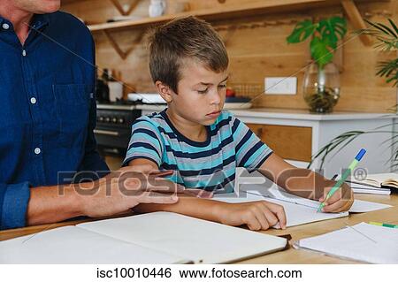Father helping son with homework at home View Large Photo Image Stock Photograph - Father helping son with homework at home. Fotosearch