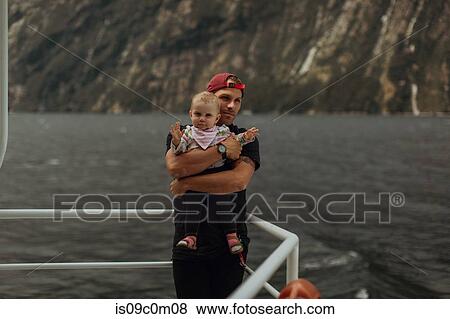 Father with baby on lake cruise, Queenstown, Canterbury, New Zealand View Large Photo Image Stock Photo - Father with baby on lake cruise, Queenstown, Canterbury, New Zealand. Fotosearch