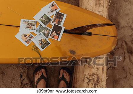 Feet of female surfer by instant photos on surfboard at beach, Ventura, California, USA View Large Photo Image Stock Photography - Feet of female surfer by instant photos on surfboard at beach, Ventura, California, USA. Fotosearch