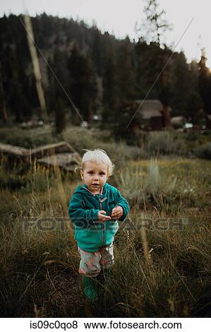 Female toddler amongst long grass in rural valley, portrait, Mineral King, California, USA View Large Photo Image Stock Photo - Female toddler amongst long grass in rural valley, portrait, Mineral King, California, USA. Fotosearch