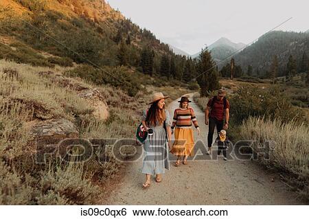 Female toddler with mother and young couple toddling along rural road, Mineral King, California, USA View Large Photo Image Stock Photograph - Female toddler with mother and young couple toddling along rural road, Mineral King, California, USA. Fotosearch