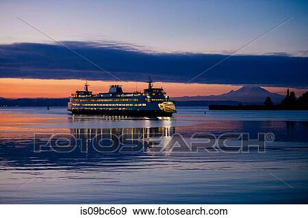 Stock Photo - Ferry on Puget Sound at sunset, Bainbridge, Washington, United States. Fotosearch