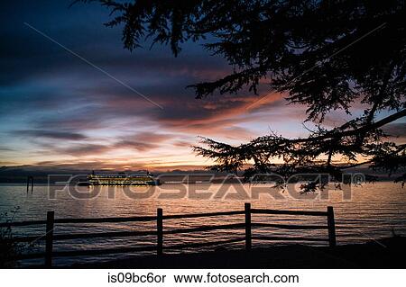 Stock Photography - Ferry on Puget Sound at sunset, Bainbridge, Washington, United States. Fotosearch