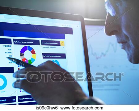 Financial services, stock analyst researching share price data of a company on the computer View Large Photo Image Stock Photograph - Financial services, stock analyst researching share price data of a company on the computer. Fotosearch