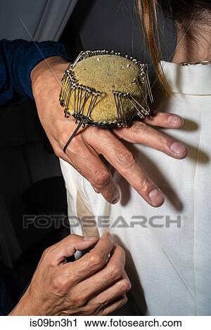 Fit model getting pinned into jacket View Large Photo Image Stock Image - Fit model getting pinned into jacket. Fotosearch