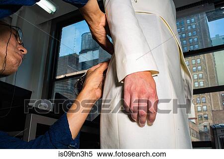 Fit model in fitting of tailored jackets before fashion week View Large Photo Image Stock Photography - Fit model in fitting of tailored jackets before fashion week. Fotosearch
