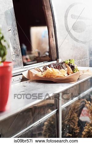 Food served through window of camper van food truck View Large Photo Image Stock Image - Food served through window of camper van food truck. Fotosearch