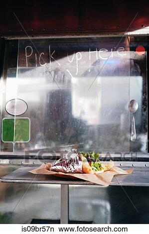 Food served through window of food truck View Large Photo Image Picture - Food served through window of food truck. Fotosearch