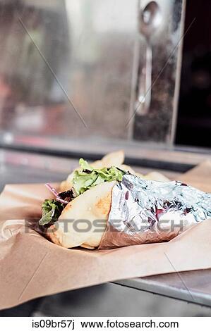Food served through window of food truck View Large Photo Image Stock Image - Food served through window of food truck. Fotosearch