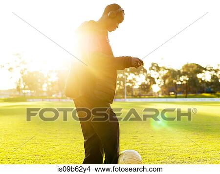 Football player with ball on field View Large Photo Image Picture - Football player with ball on field. Fotosearch