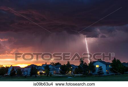 Forked lightning in orange sky over urban area, Aurora, Colorado, United States, North America View Large Photo Image Picture - Forked lightning in orange sky over urban area, Aurora, Colorado, United States, North America. Fotosearch