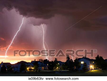 Forked lightning in orange sky over urban area, Aurora, Colorado, United States, North America View Large Photo Image Stock Photo - Forked lightning in orange sky over urban area, Aurora, Colorado, United States, North America. Fotosearch