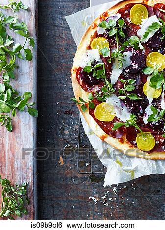 Fresh pizza with salad leaf and beetroot, overhead view View Large Photo Image Stock Photograph - Fresh pizza with salad leaf and beetroot, overhead view. Fotosearch