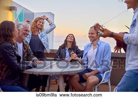 Friends at party by beach, Plettenberg Bay, Western Cape, South Africa View Large Photo Image Stock Image - Friends at party by beach, Plettenberg Bay, Western Cape, South Africa. Fotosearch