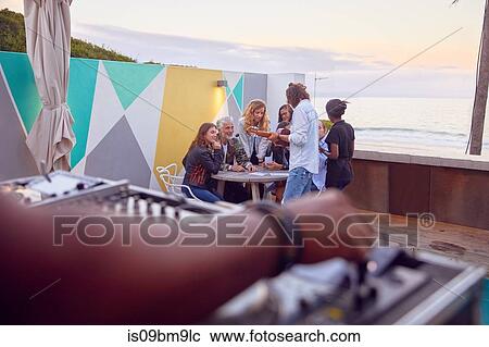 Friends at party by beach, Plettenberg Bay, Western Cape, South Africa View Large Photo Image Stock Image - Friends at party by beach, Plettenberg Bay, Western Cape, South Africa. Fotosearch