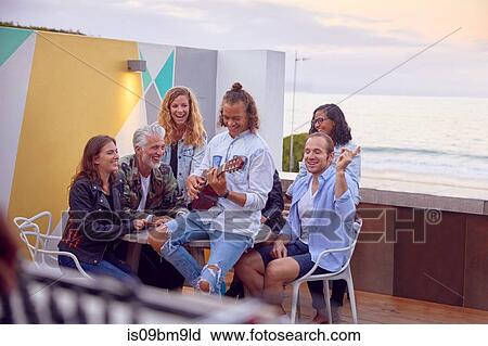 Friends at party by beach, Plettenberg Bay, Western Cape, South Africa View Large Photo Image Stock Image - Friends at party by beach, Plettenberg Bay, Western Cape, South Africa. Fotosearch