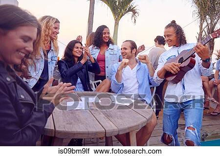 Friends at party by beach, Plettenberg Bay, Western Cape, South Africa View Large Photo Image Stock Image - Friends at party by beach, Plettenberg Bay, Western Cape, South Africa. Fotosearch