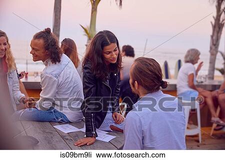 Friends at party by beach, Plettenberg Bay, Western Cape, South Africa View Large Photo Image Stock Image - Friends at party by beach, Plettenberg Bay, Western Cape, South Africa. Fotosearch