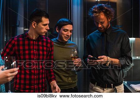 Friends at party in apartment View Large Photo Image Stock Photo - Friends at party in apartment. Fotosearch