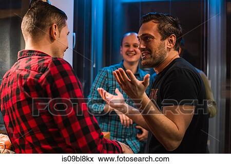 Friends at party in apartment View Large Photo Image Stock Photo - Friends at party in apartment. Fotosearch