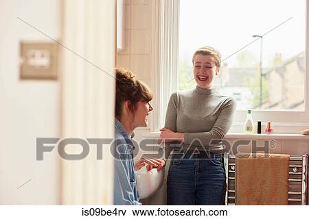 Friends chatting in bathroom View Large Photo Image Stock Photo - Friends chatting in bathroom. Fotosearch