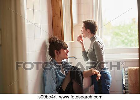 Friends chatting in bathroom View Large Photo Image Stock Photograph - Friends chatting in bathroom. Fotosearch