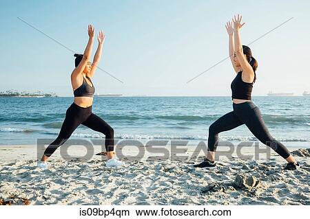 Friends doing exercises on beach, Long Beach, California, US View Large Photo Image Picture - Friends doing exercises on beach, Long Beach, California, US. Fotosearch