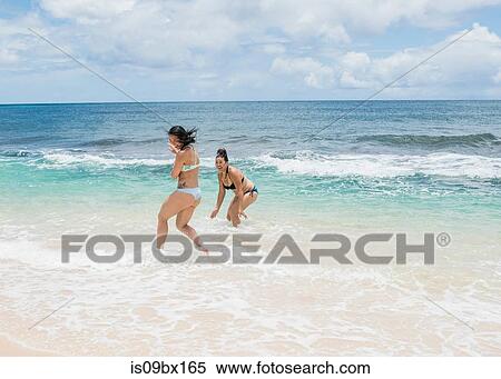 Friends enjoying Sunset Beach, Oahu, Hawaii View Large Photo Image Stock Photography - Friends enjoying Sunset Beach, Oahu, Hawaii. Fotosearch