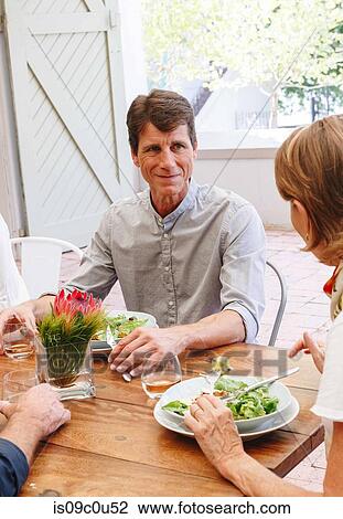 Friends having lunch in restaurant, Cape Town, South Africa View Large Photo Image Stock Image - Friends having lunch in restaurant, Cape Town, South Africa. Fotosearch