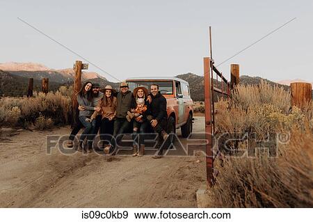 Friends in front of off road vehicle, Kennedy Meadows, California, US View Large Photo Image Stock Photo - Friends in front of off road vehicle, Kennedy Meadows, California, US. Fotosearch