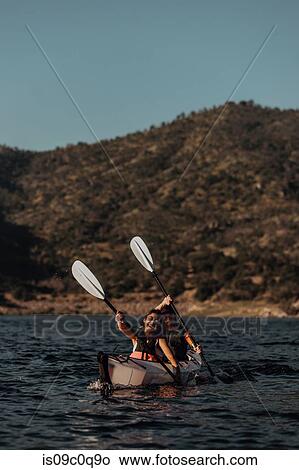 Friends kayaking in lake, Kaweah, California, United States View Large Photo Image Picture - Friends kayaking in lake, Kaweah, California, United States. Fotosearch