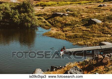 Stock Image - Friends kayaking in lake, Kaweah, California, United States. Fotosearch