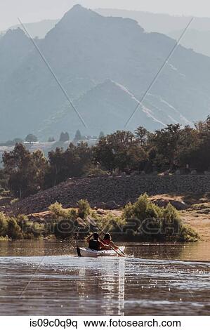 Stock Photography - Friends kayaking in lake, Kaweah, California, United States. Fotosearch