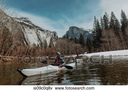 Friends kayaking in lake, Yosemite Village, California, United States View Large Photo Image Stock Photo - Friends kayaking in lake, Yosemite Village, California, United States. Fotosearch