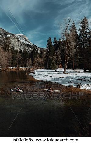 Friends kayaking in lake, Yosemite Village, California, United States View Large Photo Image Stock Photo - Friends kayaking in lake, Yosemite Village, California, United States. Fotosearch