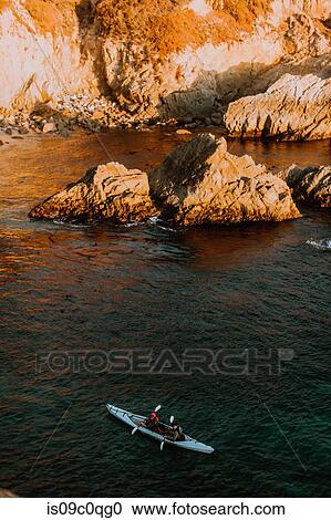 Friends kayaking in sea, Big Sur, California, United States View Large Photo Image Stock Image - Friends kayaking in sea, Big Sur, California, United States. Fotosearch