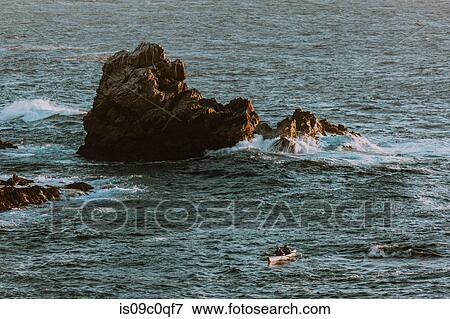 Stock Photo - Friends kayaking in sea, Big Sur, California, United States. Fotosearch